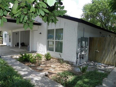 View of side of home featuring brick siding