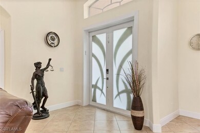 Entryway with light tile patterned flooring and fr