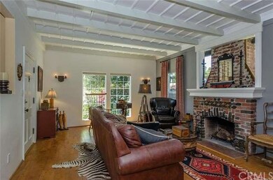 Living Room facing Chorro.  Original wood beamed c