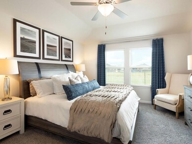 Bedroom featuring carpet flooring, baseboards, an