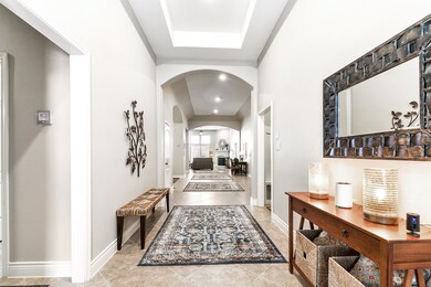 As you step into the home's foyer, you are greeted with a grand introduction to the living room. Its generous space and welcoming ambiance set the tone for the entire home. This well-designed entryway offers ample room for various decor elements, creating an inviting atmosphere.