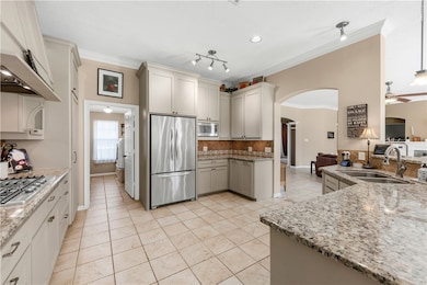 Kitchen with appliances with stainless steel finis