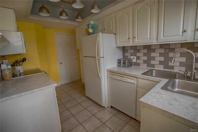 Updated kitchen with backsplash and pendent lighti