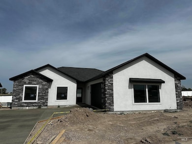 View of front of property with stucco siding and stone siding