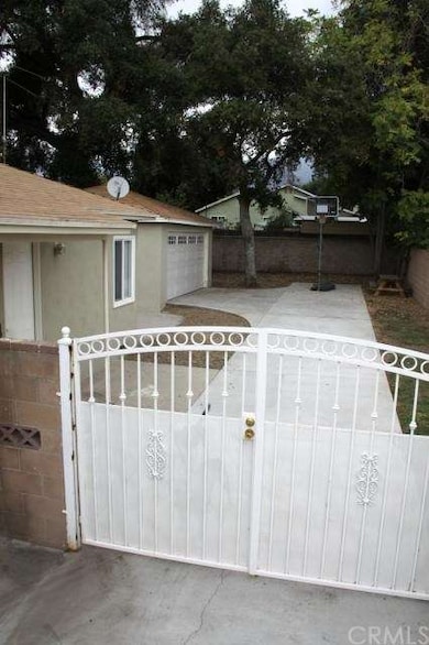 View of rear yard leading to two-car garage!