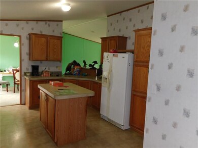 Kitchen has tons of space, a center island, a pant