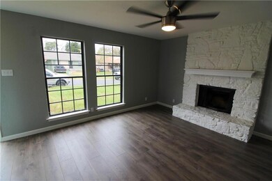 Unfurnished living room featuring dark wood finis