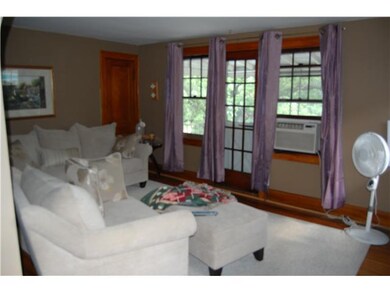 Living Room. Second floor flat with open porch.