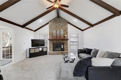 Vaulted Great Room with Stone Fireplace