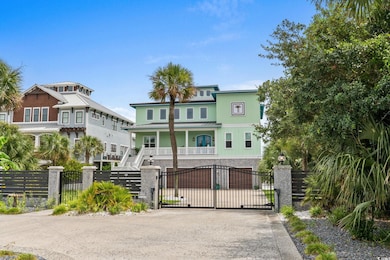 Gate featuring a fenced front yard, stairway, and covered porch
