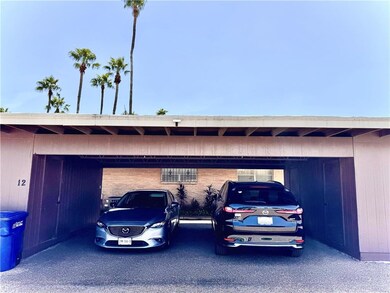 Garage featuring a carport