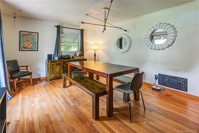 Spacious front room could be living or dining room.