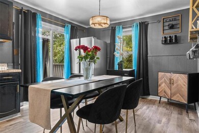 Dining space with a chandelier and light wood-style floors