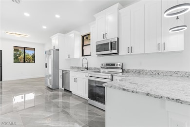 1107 W 18th St, Lehigh Acres, FL 33972 - photo 2