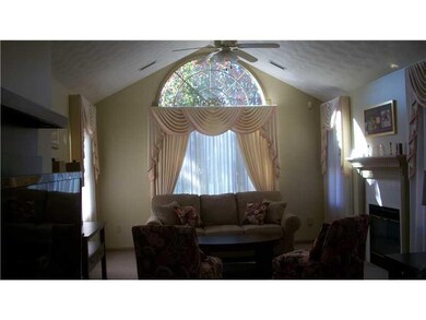 Living Room. Cathedral ceilings provide an open, a