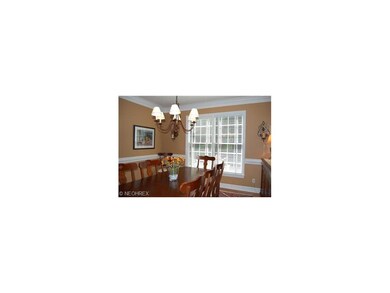Formal Dining Room with crown moulding and wainsco