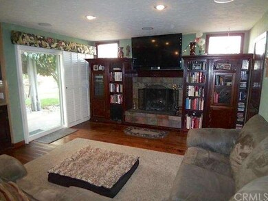 Welcoming family room with fireplace, surround sou