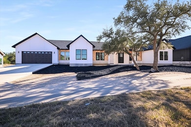 Modern farmhouse with driveway, a shingled roof, and an attached garage. This photo has been Ai Enhanced.