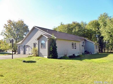 Exterior Back. Large flat yard with oversized gara