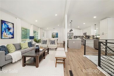 Main floor living/dining/kitchen is open and brigh
