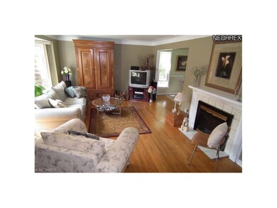 LIVING ROOM WITH WOOD FLOORS, FIREPLACE AND PICTUR