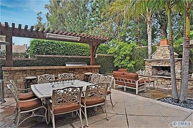 Custom BBQ island has granite counters, side burne