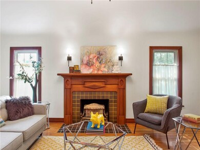 Filled with light the lvingroom has a working gas fireplace fixture, restored by Tyson. All windows in the house replaced.