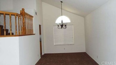 Dining room with cathedral ceilings.