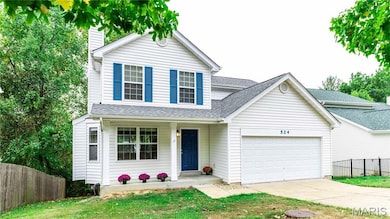 Traditional-style home featuring roof with shingles, concrete driveway, covered porch, and a garage