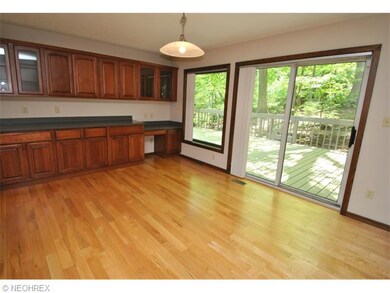 Spacious eating area with wall of cabinets (some w