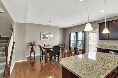 Kitchen includes granite countertops and an island