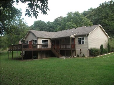 Talk about relaxing . . . serene backyard with large deck for grilling and entertaining overlooking the flowing creek. Fun times with a fire pit with family and friends! Deer, turkeys, etc. love this pretty creek back yard!