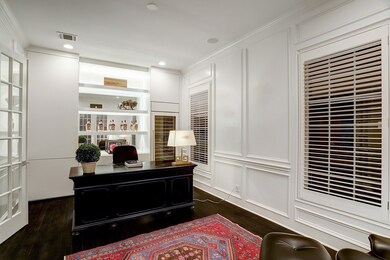 The study boasts hardwood flooring, solid wood pan
