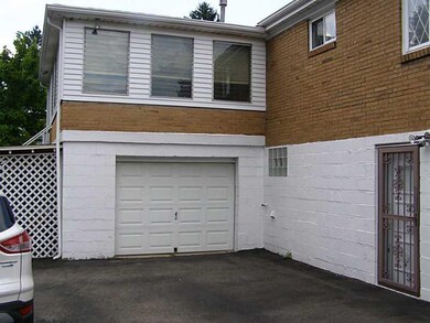 Exterior Front. New Garage Door