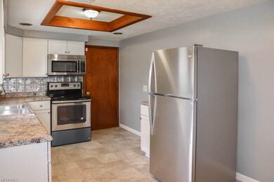 The kitchen has stainless steel appliances!