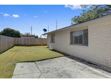 Photo. side courtyard with concrete pad for entert