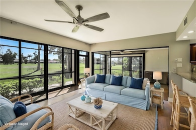 Virtually staged creating a seating space/area near kitchen breakfast bar