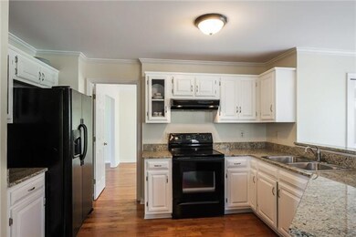 This beautiful kitchen is so inviting! Modern cabinets and stainless steal appliances.