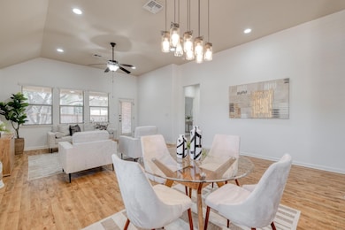 Dining area with light wood-style flooring, ceili