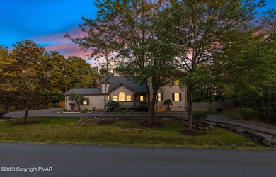 Front Dusk View w/ Circular Driveway