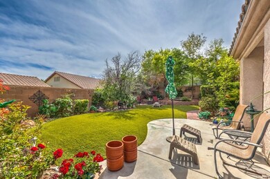 View of yard featuring a fenced backyard and a pat