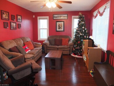 Living room with refinished wood flooring.