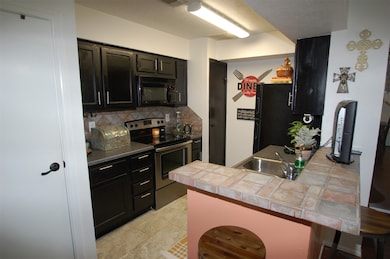 Kitchen with tile countertops
