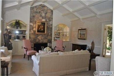 Large Living Room Showcases Beautiful Wainscoting,