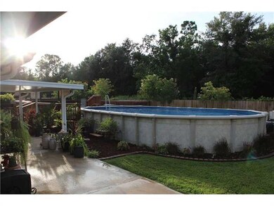 Backyard. Swimming pool with large deck and two co
