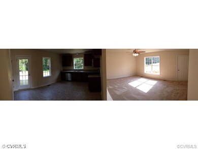 Panorama of Kitchen and Family Room. To be built. This picture is a representation of a similar house.