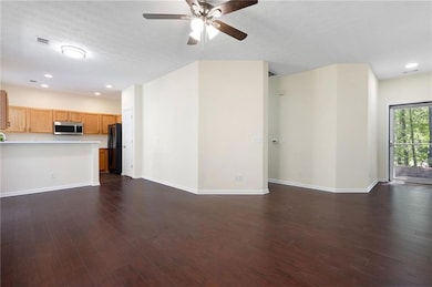 Unfurnished living room with baseboards, visible v