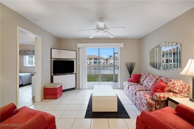Tiled living room featuring ceiling fan