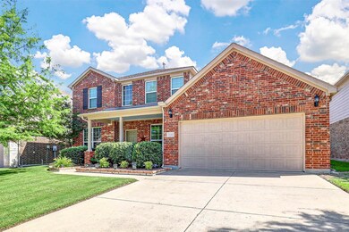 Front of property featuring a garage and a front l