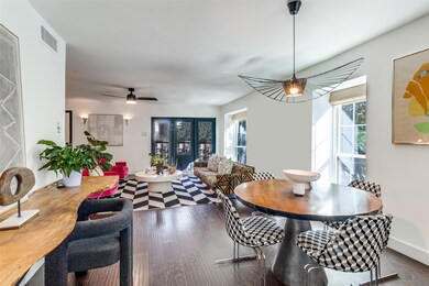Dining area with dark wood-type flooring and a ceiling fan